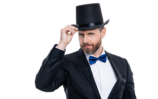 presenter man with cylinder hat, copy space. man presenter wear cylinder hat in studio. presenter man posing in studio. man presenter isolated on white background.