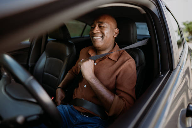 istock Male driver putting safety seat on car 1473501981