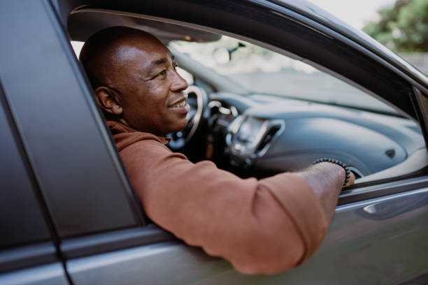 istock Passenger in car mature man looking at view 1473501991