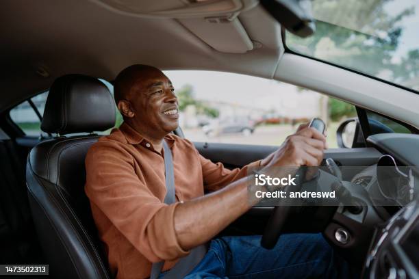 Portrait Of A Mature Male Driver In The Car Stock Photo - Download Image Now - Driving, Car, Driver - Occupation