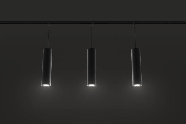 istock Track lighting system, pendant ceiling lamps at night 3d render. Modern black metal long tubes, accent light for exhibition hall, cafe or office interior isolated on dark background 1473502464