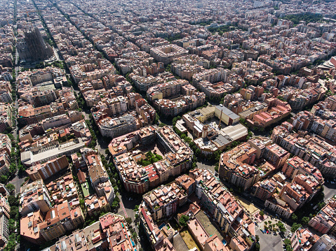Drone view of the famous quarters of Barcelona  and Sagrada Familia Cathedral