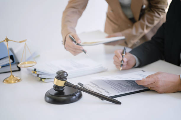 istock lawyer consulting with client discussing about contract. 1473503764