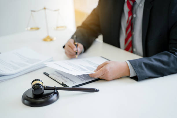 istock lawyer consulting with client discussing about contract. 1473503779