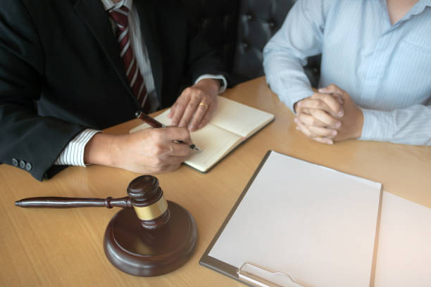 istock lawyer consulting with client discussing about contract. 1473503834