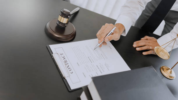 istock lawyer consulting with client discussing about contract. 1473503882