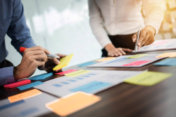 istock Startup concept, Group of young people brainstorming shared business idea. 1473505493