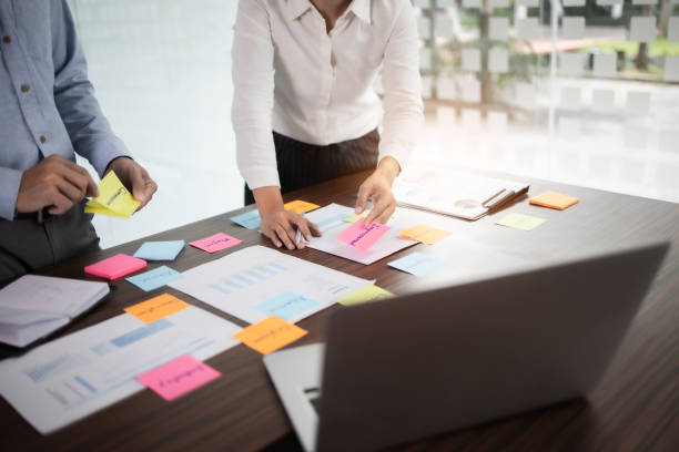 istock Startup concept, Group of young people brainstorming shared business idea. 1473505542