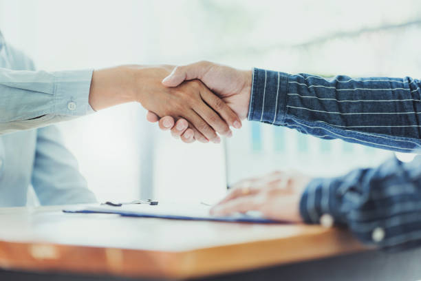istock Teamwork colleagues business people handshake after meeting. 1473505565