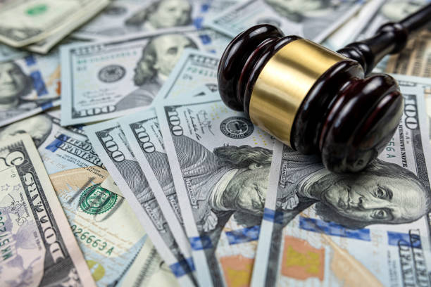 istock judge gavel and 100 dollar bills as background 1473506289