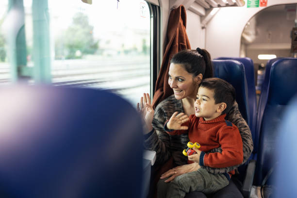 istock Mother and son traveling by the train 1473506604