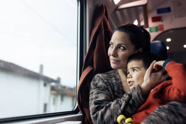 istock Mother and son traveling by the train 1473506855