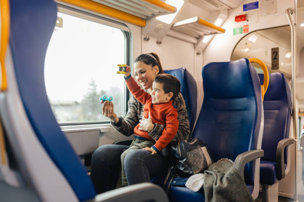 istock Mother and son traveling by the train 1473507581