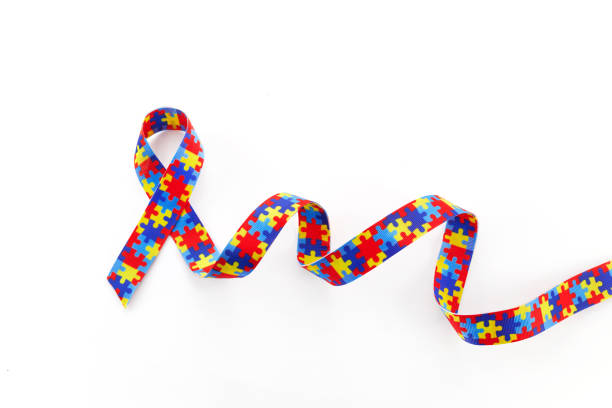 istock World Autism awareness and pride day or month with Puzzle pattern ribbon on white background 1473507628