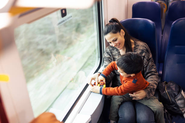 istock Mother and son traveling by the train 1473507633
