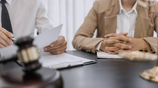 Lawyer and client negotiation in legal judgement consulting. Lawyer and client negotiation in legal judgement consulting. legal defense stock pictures, royalty-free photos & images