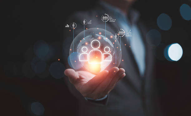 istock Businessman holding virtual human icon on world map for business CRM or Customer Relation Management and customer service concept by use social media technology. 1473508503