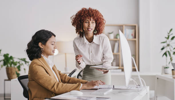 istock Office computer, communication and personal assistant with leader, manager or boss talking, consulting and review online research. Conversation, ecommerce partnership and teamwork on corporate data 1473508654