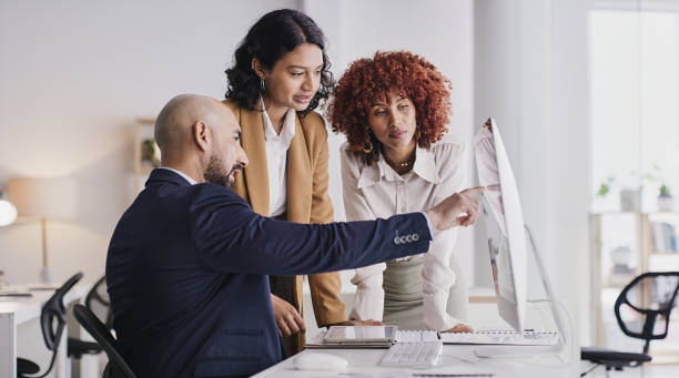 istock Administration teamwork, computer or business people point at financial diversity funding, finance or online accounting. Fintech database, data analysis or accountant collaboration on bank compliance 1473508658