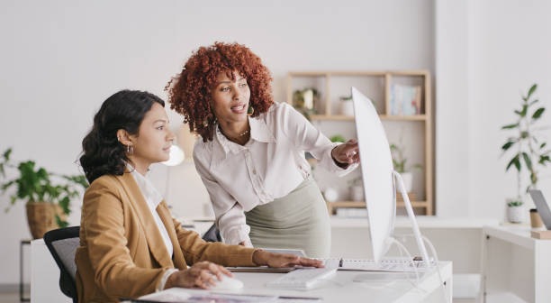 istock Computer, business communication and diversity women, management team or people talking, consulting and review research. Collaboration, ecommerce partnership or teamwork on corporate data analysis 1473508674