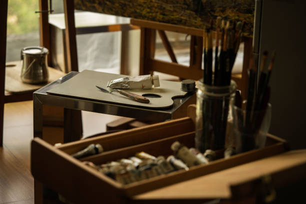 istock Painting supplies in artist studio. 1473509738