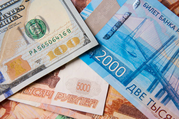 istock Dollar and Ruble money background, close-up 1473509938