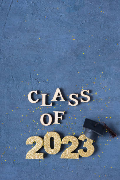 istock Graduated 2023 concept. Class of 2023 text with graduate cap on dark background with bokeh 1473509974