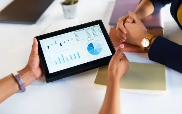 Photo of Hands, business people and tablet chart for data analysis, infographic review or dashboard logistics. Digital technology, analytics graphs and meeting to research internet statistics, growth or stats