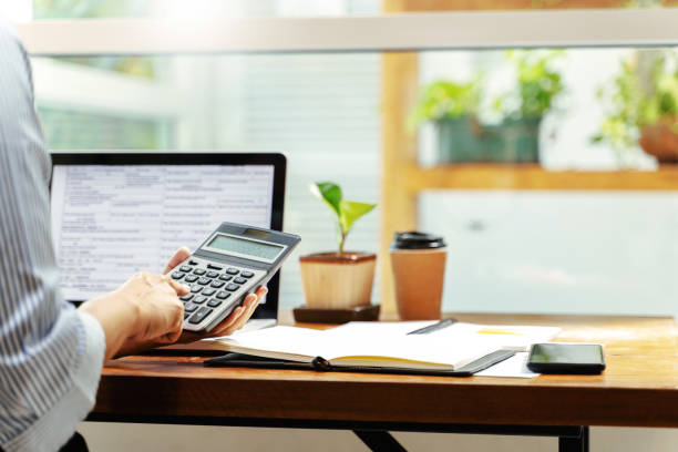 istock Financial inspector calculating a numbers in office room. 1473513024
