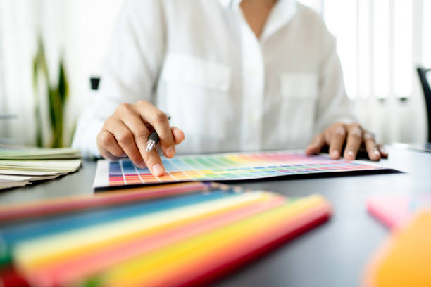 istock Creative graphic designer team working with colour swatch sample, Brainstorming ideas in studio. 1473513035
