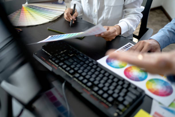 istock Creative graphic designer team working with colour swatch sample, Brainstorming ideas in studio. 1473513043