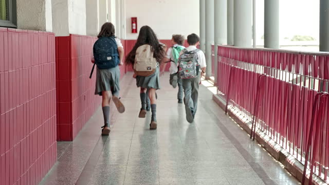 Elementary school children running to class