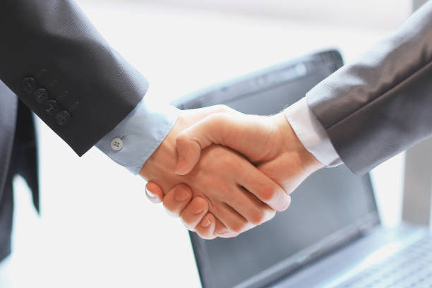 istock close up. handshake of business partners on the work table 1473517158
