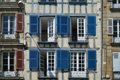 Blue shutters of a building in downtown Bayonne, in the Basque Country