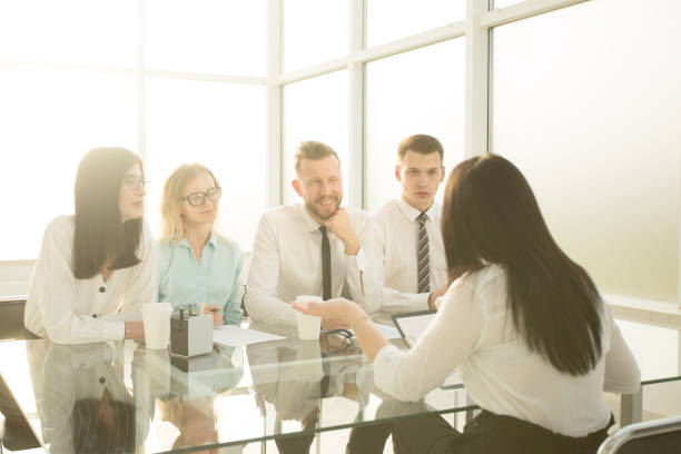 istock group of HR managers interview a young female candidate 1473519243