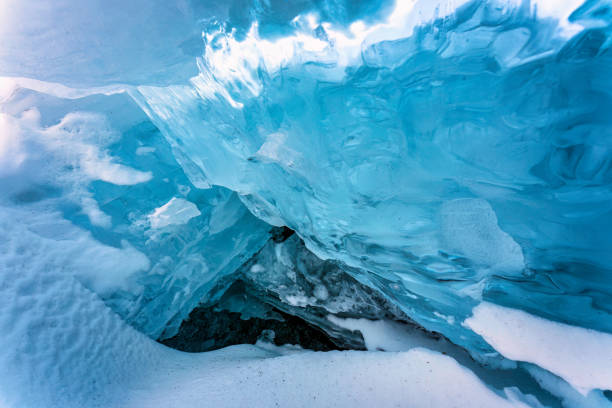 istock Natural ice cave in frozen lake on winter 1473519270