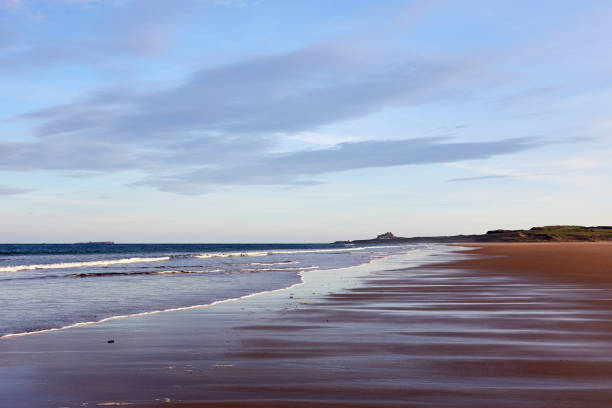 istock Sunset over a sandy beach and coastline 1473519495