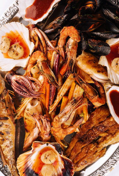istock fresh shrimp, scampi, mussels, squid, octopus and scallops 1473519509