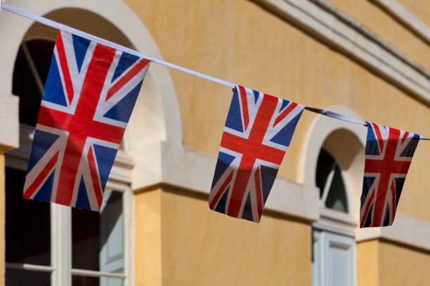 Union jack bunting Red, white and blue british flag bunting to celebrate the VE Day. ve day celebrations uk stock pictures, royalty-free photos & images