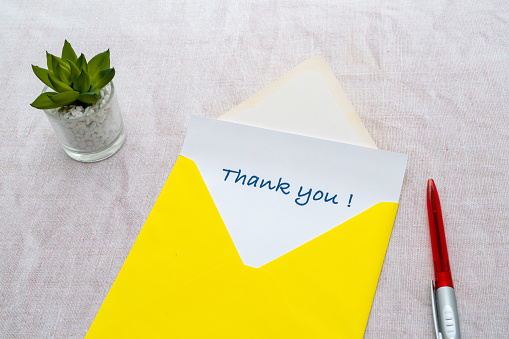 A Thank you note in an envelope