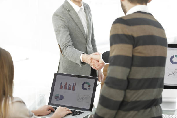 istock Manager and the client shake hands when meeting in the office 1473525209