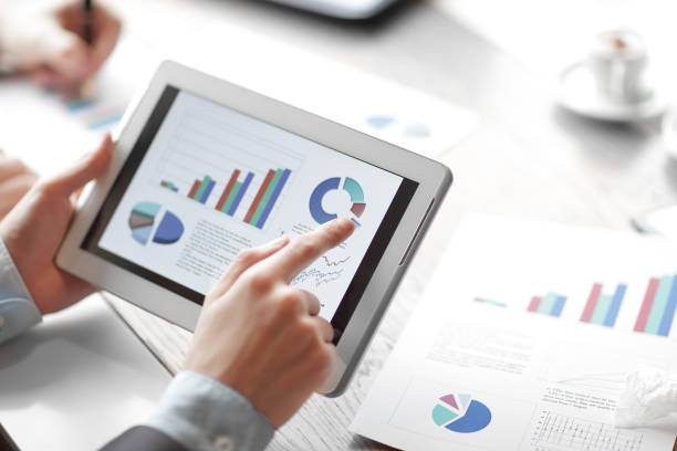 istock close up.financial report on the digital tablet screen. 1473525334