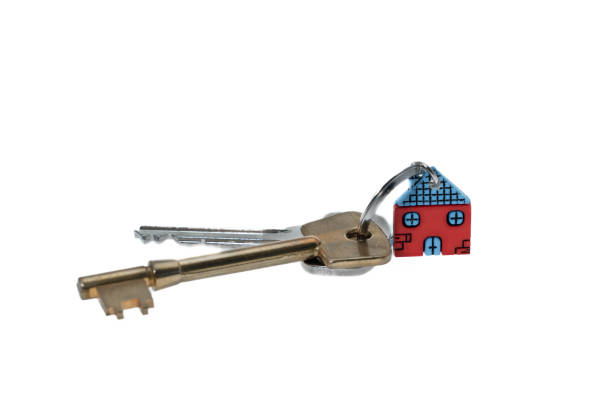 istock House Keys And Key chain - white background 1473525746