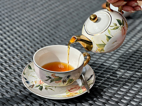 Tea being poured into a cup