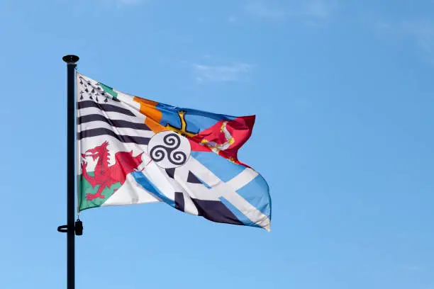 Interceltic flag with in its center a triskel surrounded by the banners of the Celtic countries and regions.