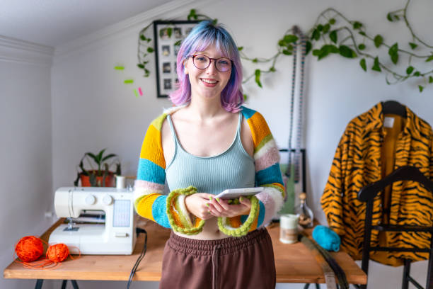 Portrait of a young fashion designer in her workshop Portrait of a young fashion designer in her workshop studio workplace stock pictures, royalty-free photos & images