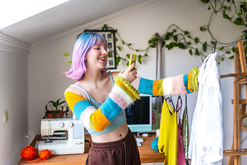 Portrait of young girl selling her clothes online