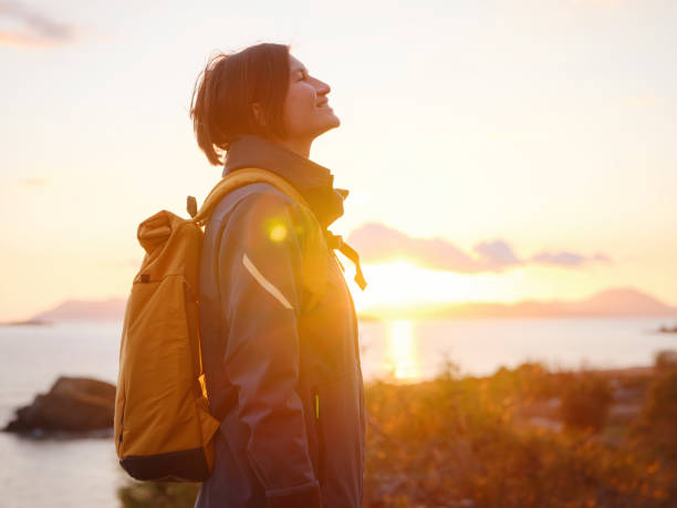 istock Woman resting alone over the sea shore, 1473528390