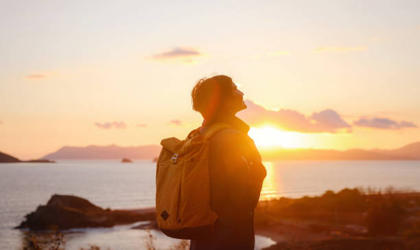 istock Woman resting alone over the sea shore, 1473528446
