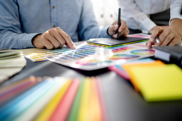 istock Creative graphic designer team working with colour swatch sample, Brainstorming ideas in studio. 1473528505
